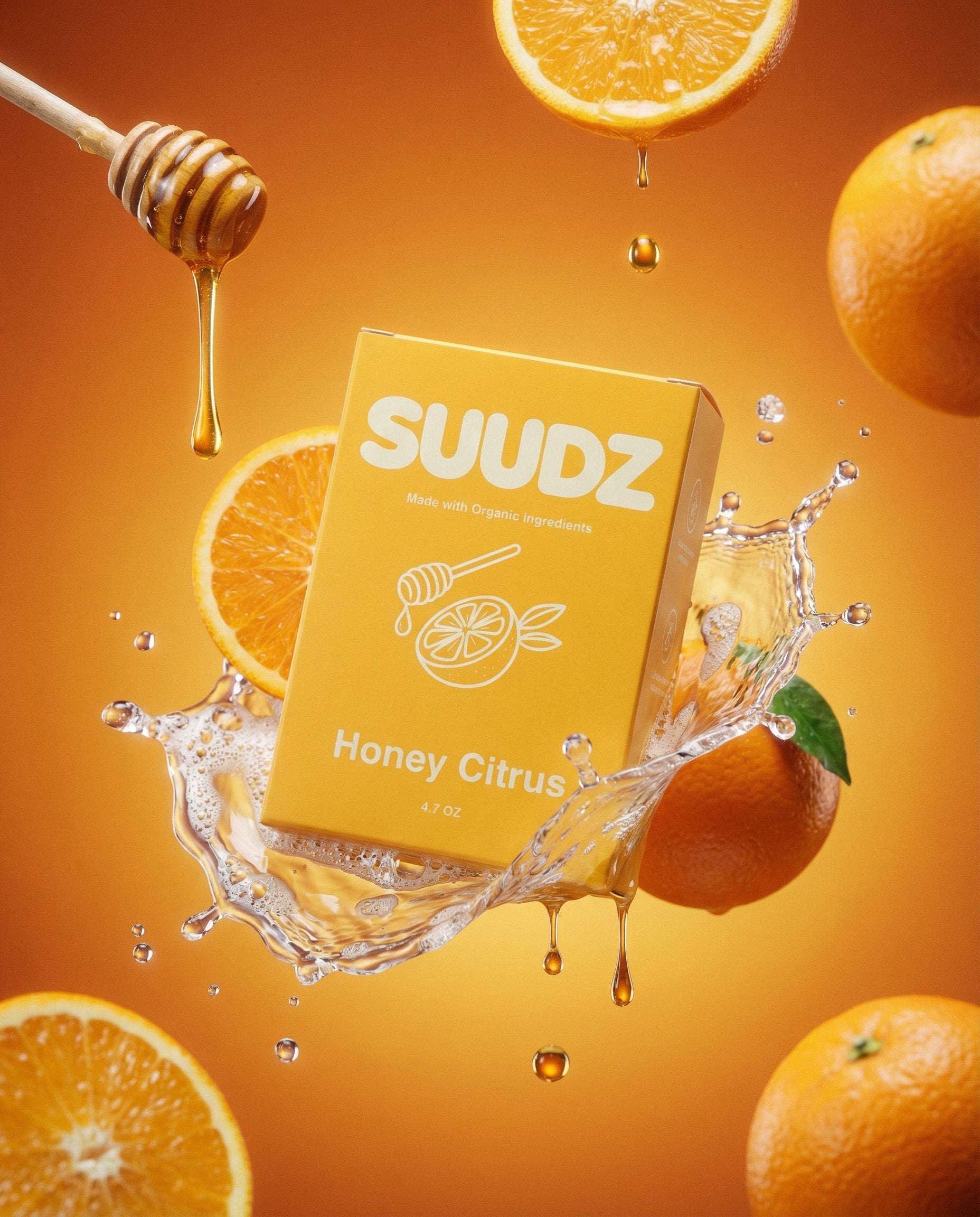 SUUDZ Honey Citrus product packaging with oranges and honey on an orange background