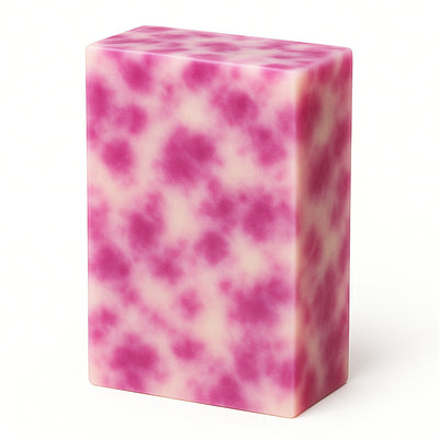 Pink and white marbled soap bar on a white background